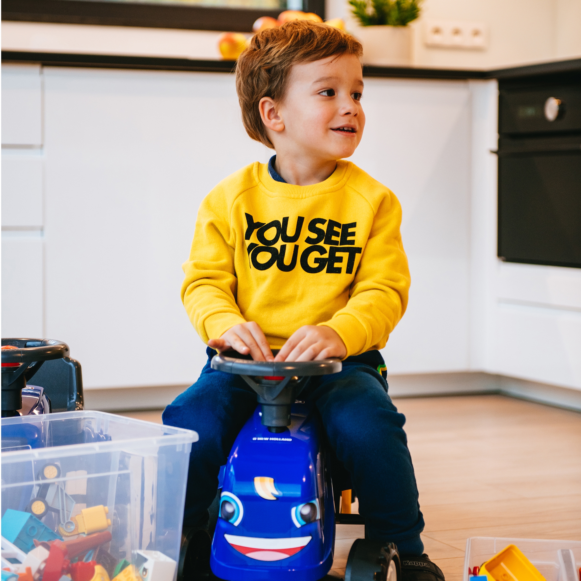 Traktorek baby new holland niebieski z przyczepką + akc. od 1 roku