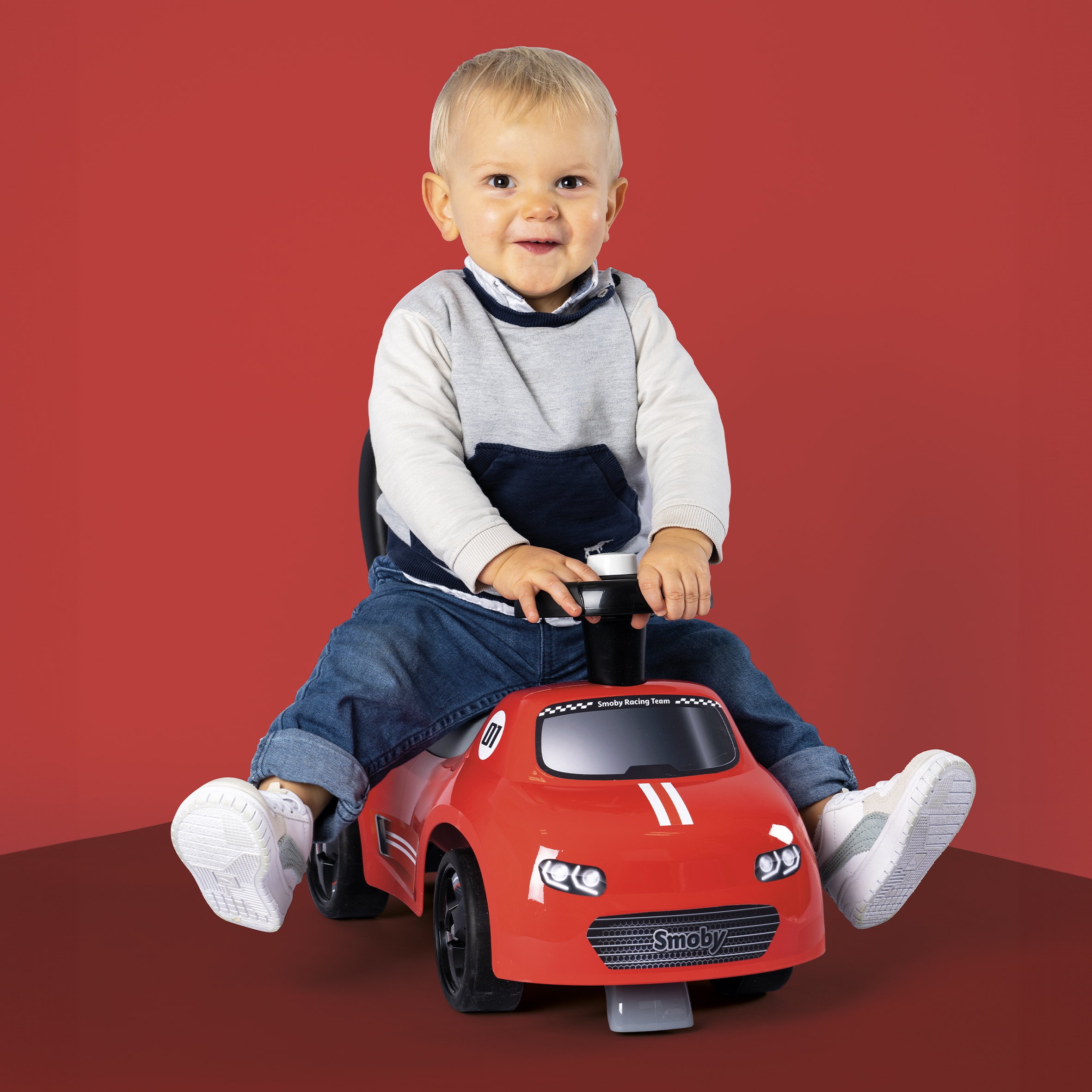 Czerwony jeździk z klaksonem ride-on
