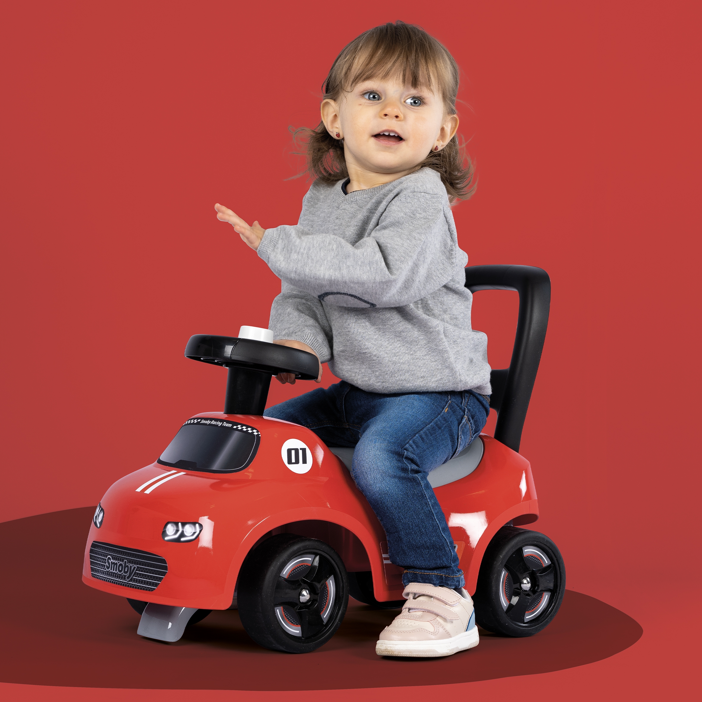 Czerwony jeździk z klaksonem ride-on